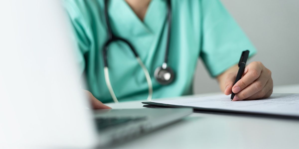 clinician documenting