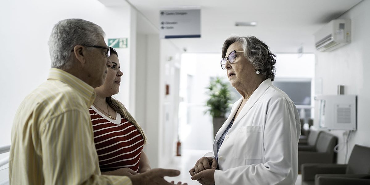 Female doctor talking to family